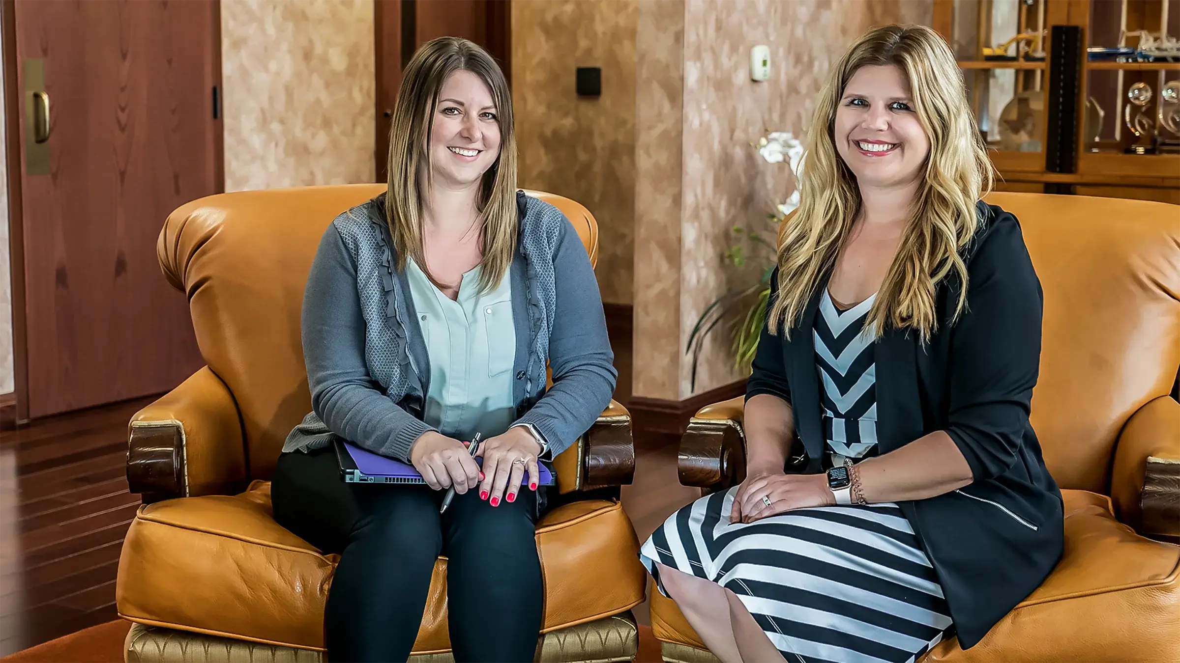 Two women sit in the Browsnville Wisconsin recpetion area